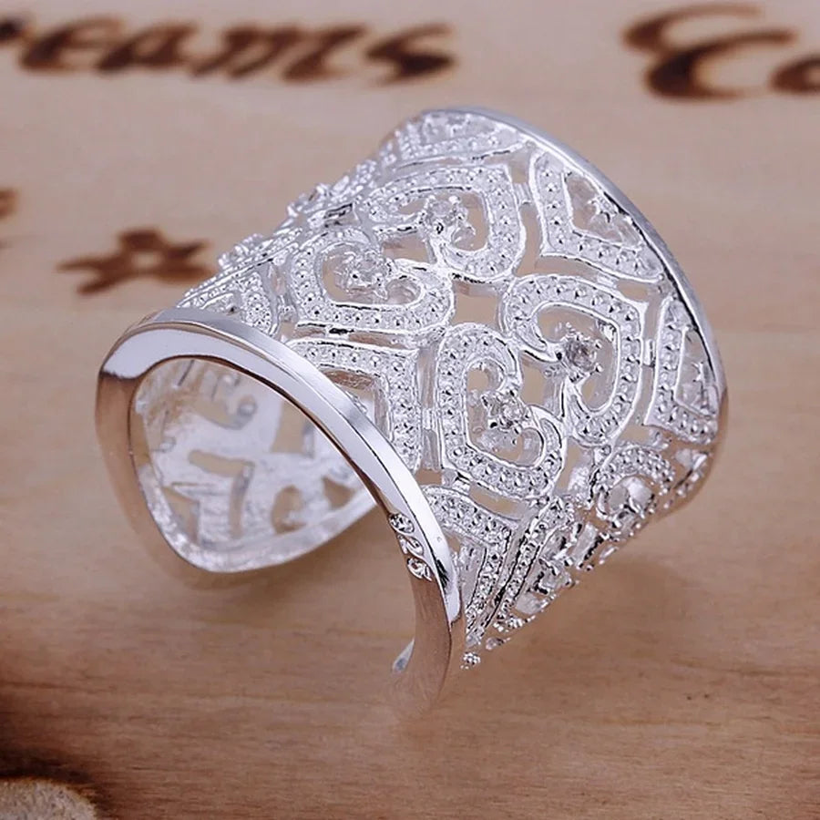 Sterling silver 925 ring from Corporación Turística, showcasing a sleek, shiny band with intricate design details.