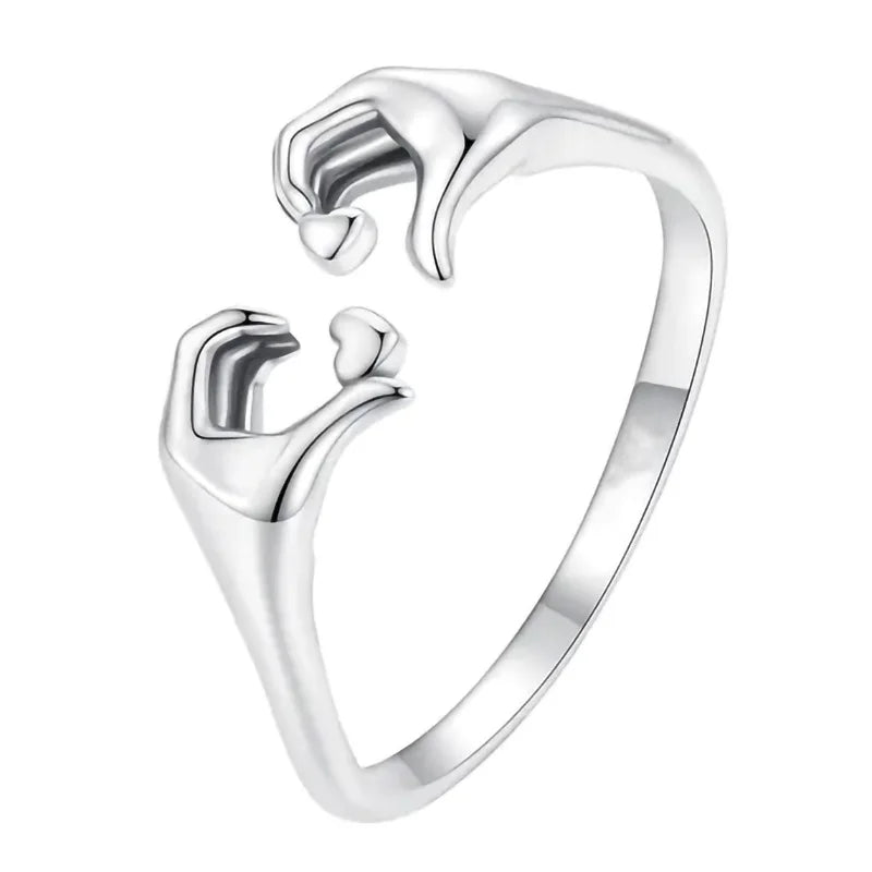 Adjustable heart-shaped ring by Corporación Turística, featuring European and American design, in a close-up image.