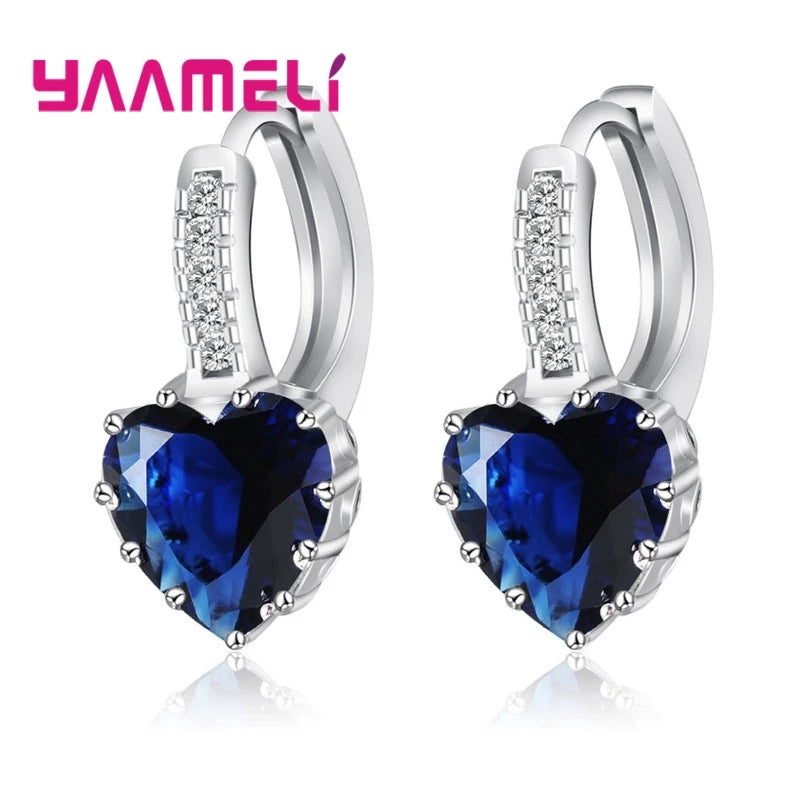 YAAMELI circular red cubic zirconia hoop earrings for women, stylish jewelry by Corporación Turística.