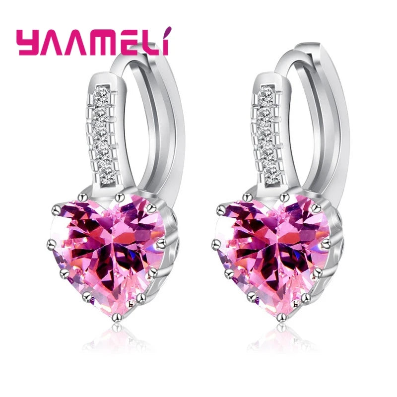 YAAMELI circular red cubic zirconia hoop earrings for women, stylish jewelry by Corporación Turística, close-up view of the earrings
