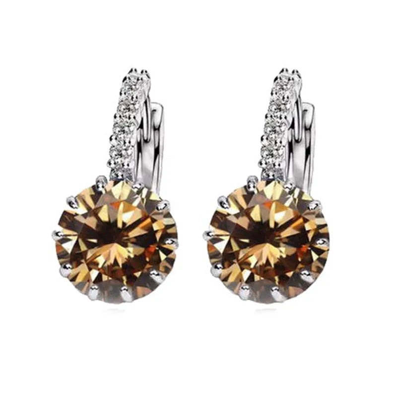 Red circular cubic zirconia hoop earrings for women by YAAMELI, featuring sparkling gemstone accents and a stylish design.