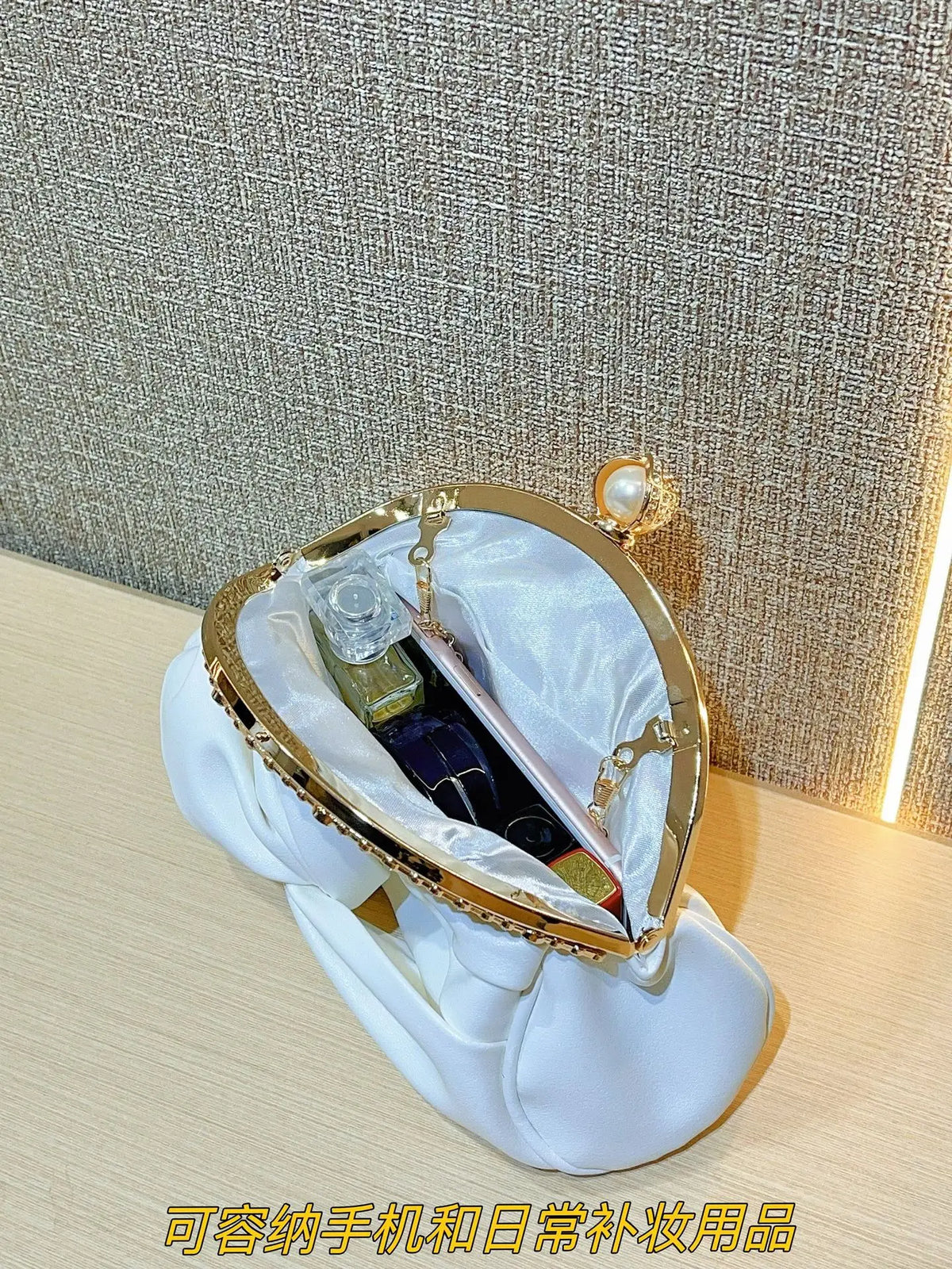 Luxury red women's shoulder bag with chain strap by Corporación Turística, stylish and elegant for everyday or special occasions.
