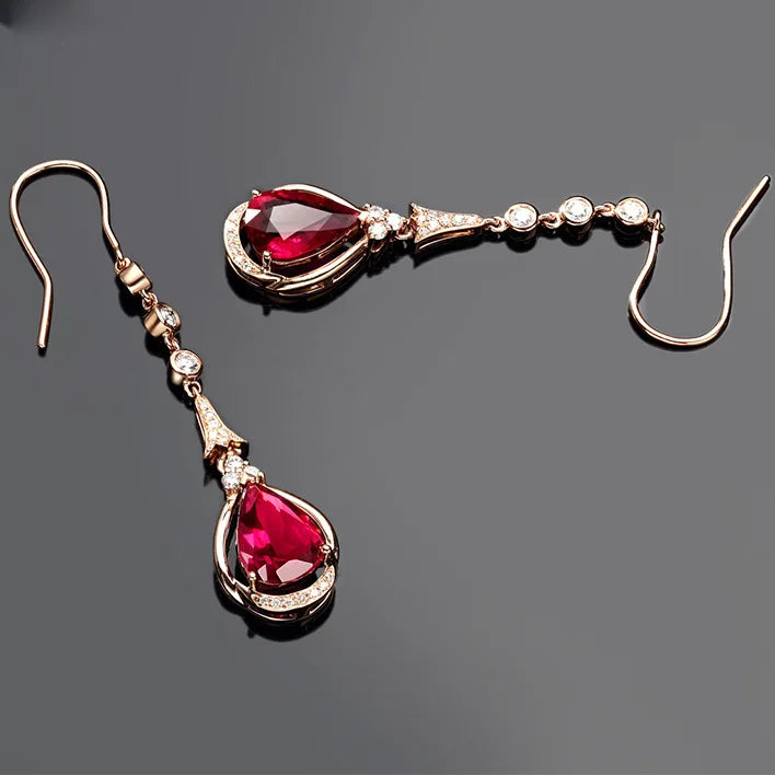 Rose gold 18K ruby pendant earrings with natural ruby gemstones, elegant and stylish jewelry by Corporación Turística.