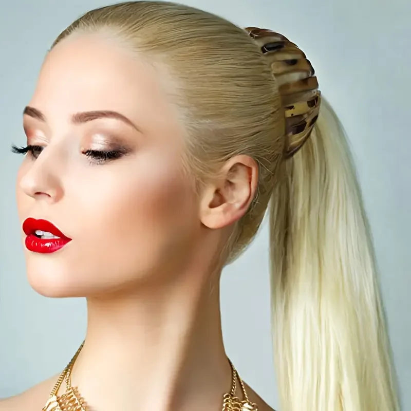 Red fashion bird’s nest hair clip by Corporación Turística, showcasing the unique, stylish design for securing hair.