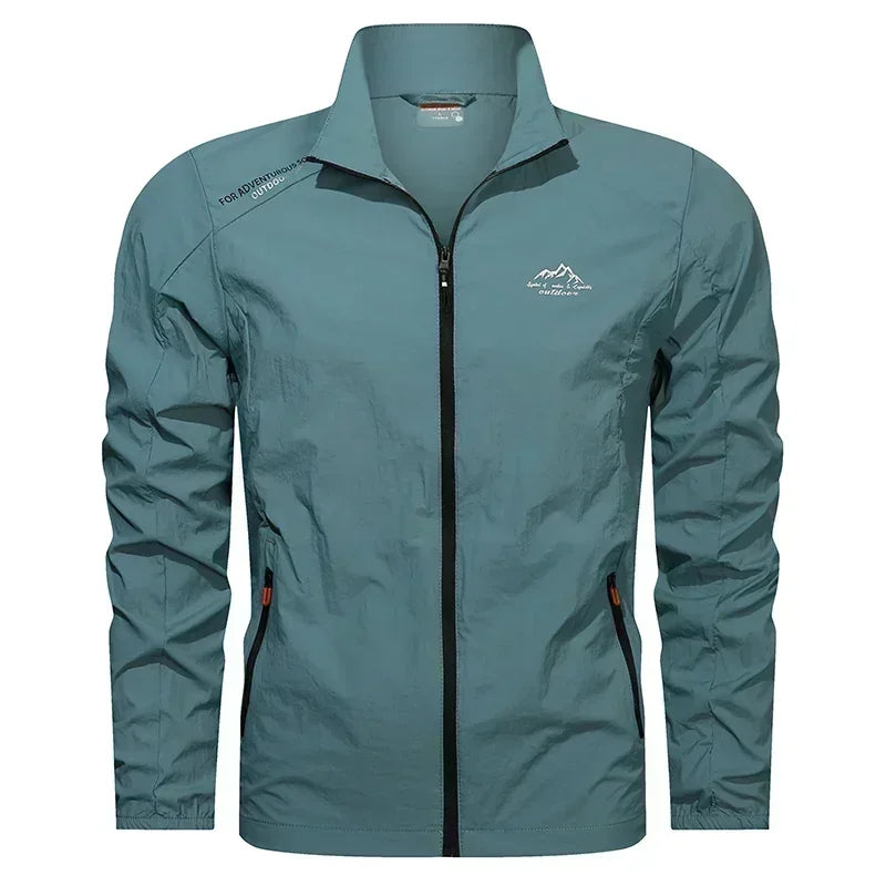 Blue denim men's UPF100+ ultralight summer windbreaker jacket with pockets, designed for UV protection and outdoor wear.