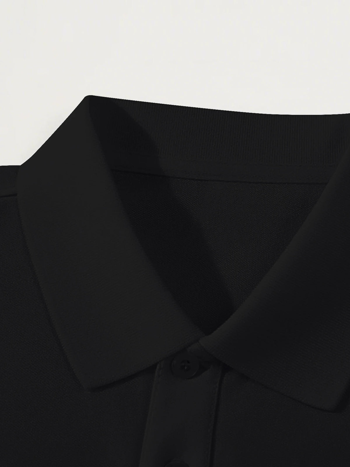 Elegant black men's polo shirt by Corona Real, short sleeves, polyester, available in sizes S to XXL, from Corporación Turística.