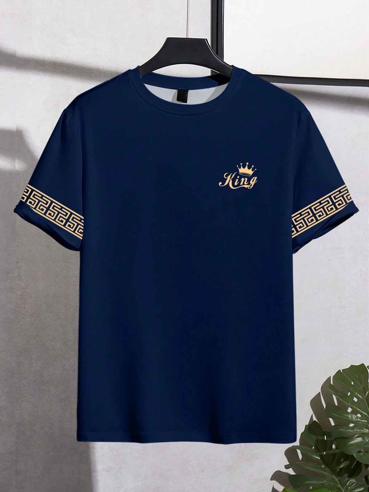 Black men's "King" T-shirt by Corporación Turística with gold print, casual style, featuring a comfortable fit and stylish design.