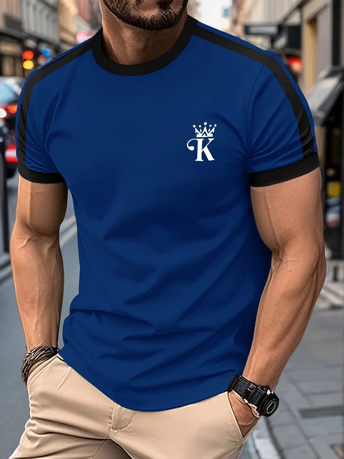 Black men's "King" T-shirt by Corporación Turística with gold print, casual style, featuring a bold graphic design.
