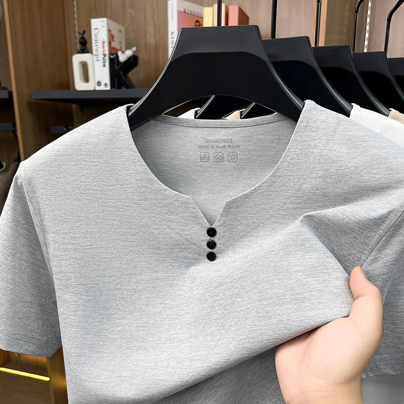 White men's Henley t-shirt by Corporación Turística, casual summer short-sleeve cotton shirt with breathable fabric.