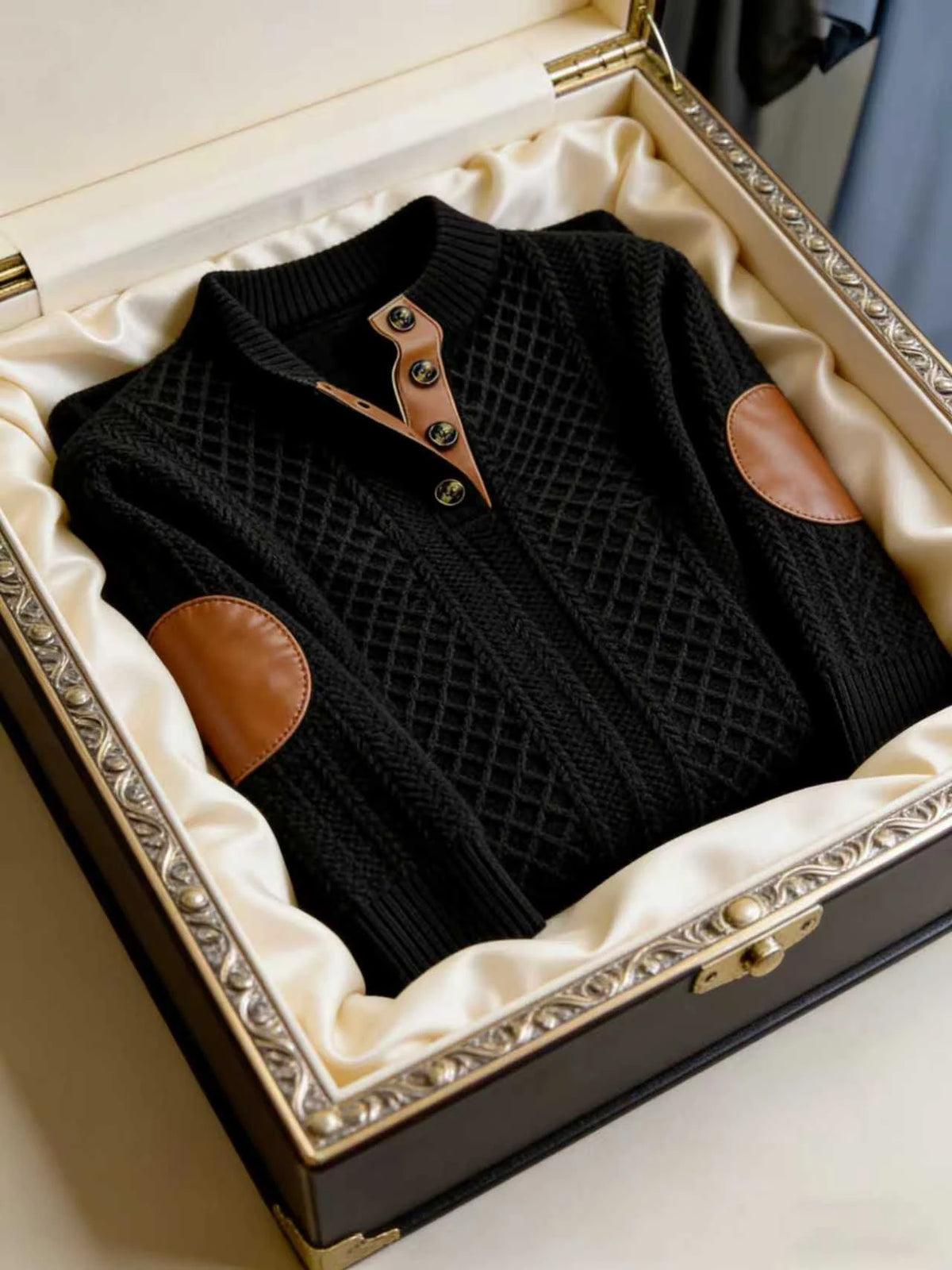 Black embroidered men's hoodie from Corporación Turística, casual fall/winter sweatshirt with a raised collar and hood.