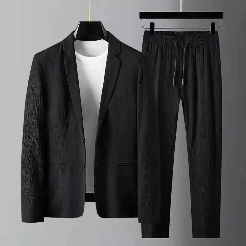Lightweight, wrinkle-resistant men's two-piece casual suit by Corporación Turística, featuring a white blazer and matching trousers.