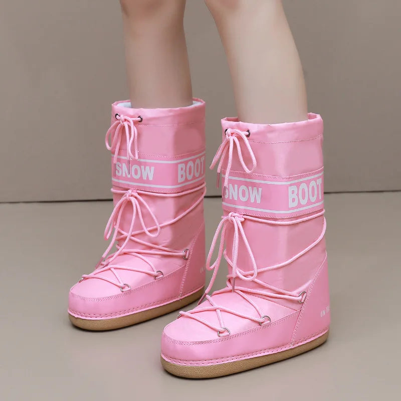 Pink winter snow boots by Corporación Turística, mid-calf length, ideal for cold weather with insulated and waterproof features.