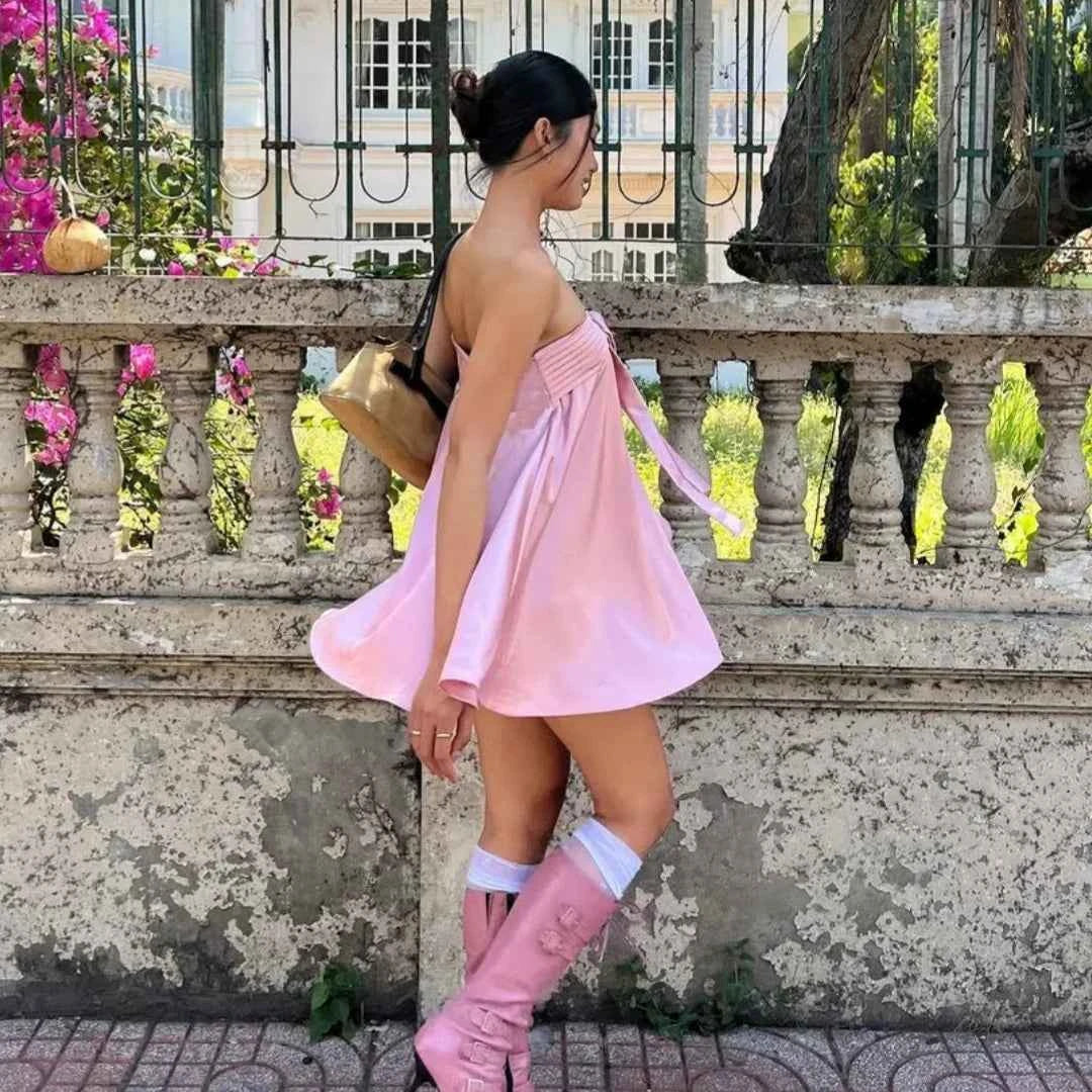 Elegant pink satin strapless dress for women, featuring a sleek design and smooth fabric, perfect for formal occasions.