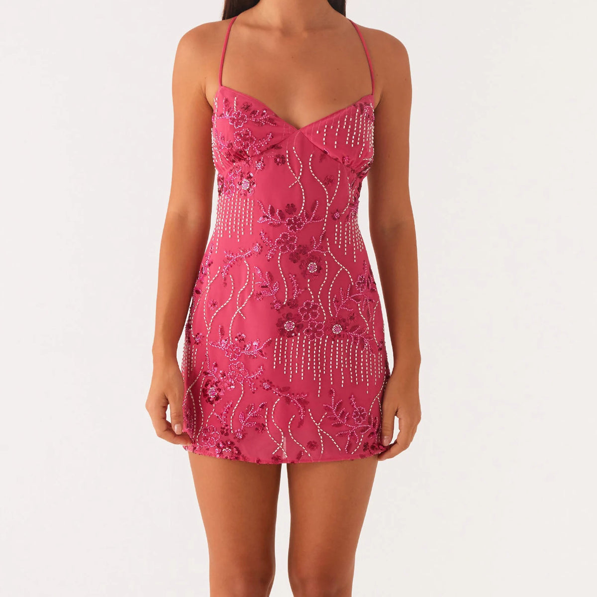 Pink minidress for women with shiny sequins, stylish and sexy, perfect for parties or night out, by Corporación Turística.
