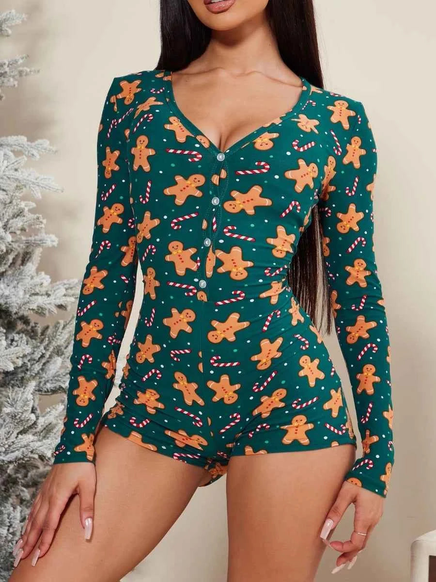 Pink long-sleeve Christmas onesie for women, cozy sleepwear from Corporación Turística, featuring festive holiday design.