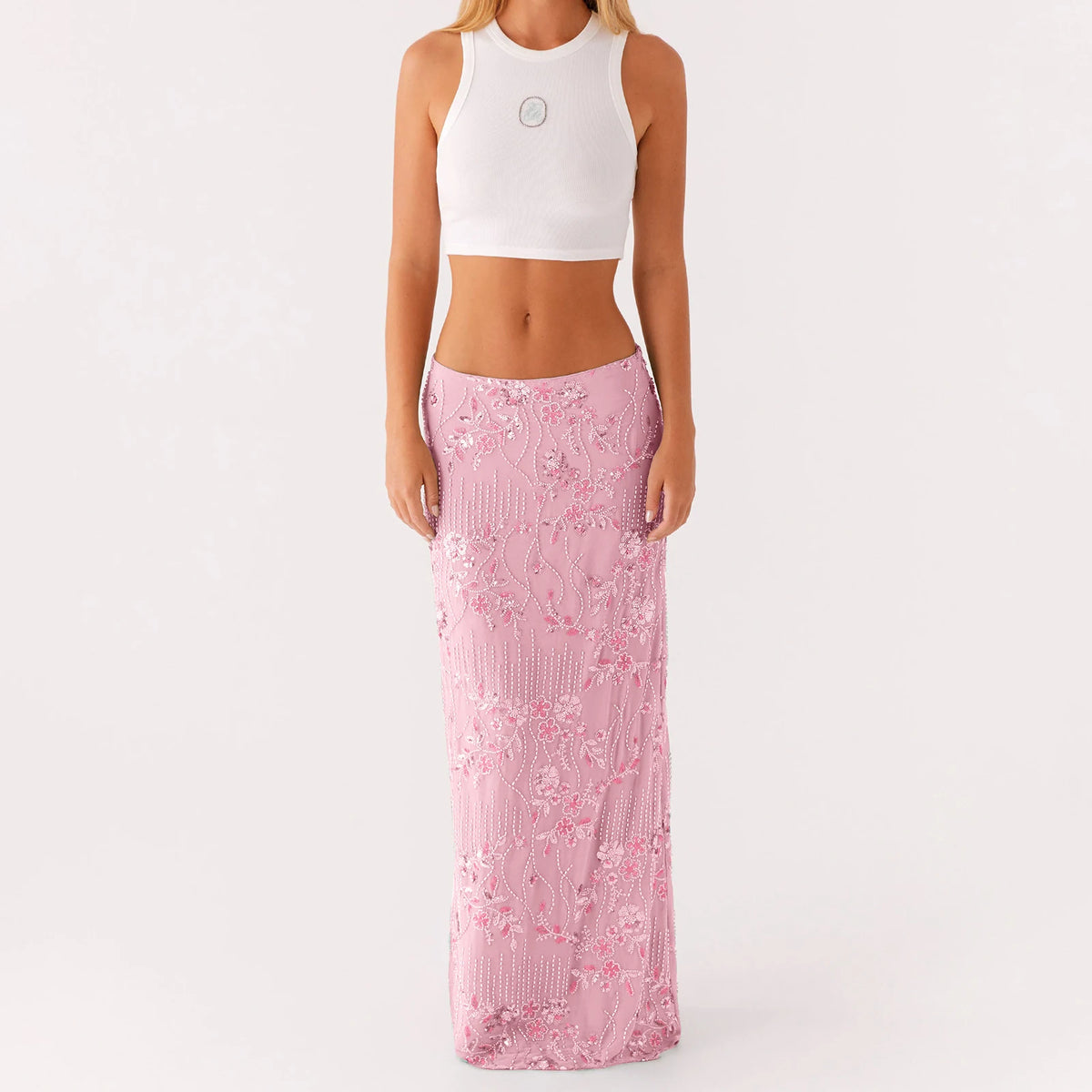 Elegant long pink skirt with sequins and beads for women, featuring a flowing design and intricate embellishments.