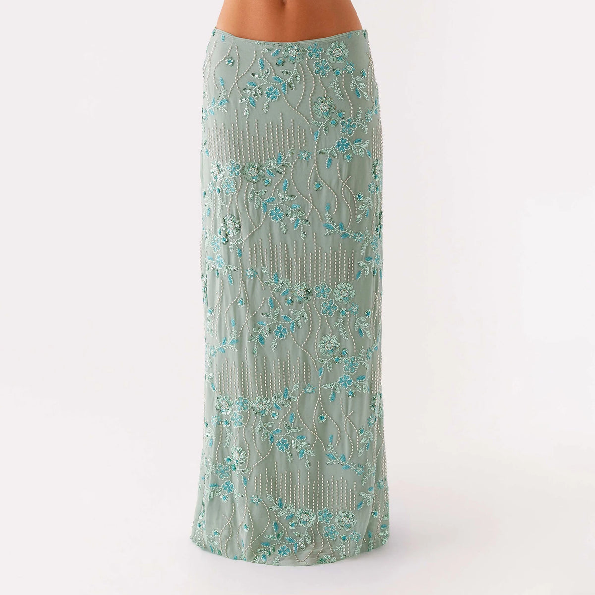 Elegant long women's skirt with sequins and beads in vibrant pink, featuring a flowing design and intricate embellishments.