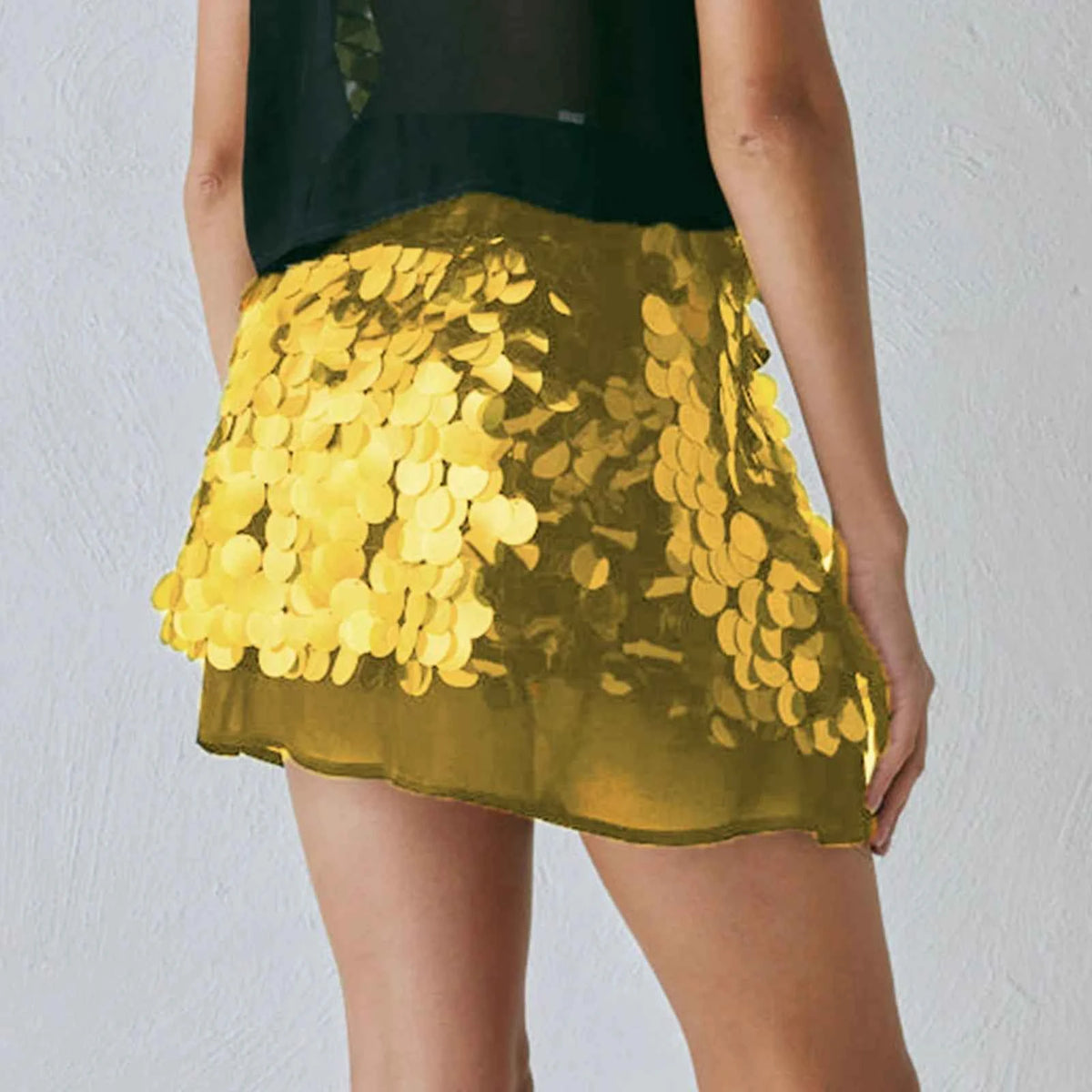 Pink sequin mini skirt for women, summer fashion by Corporación Turística, fitted pencil style with shiny embellishments.