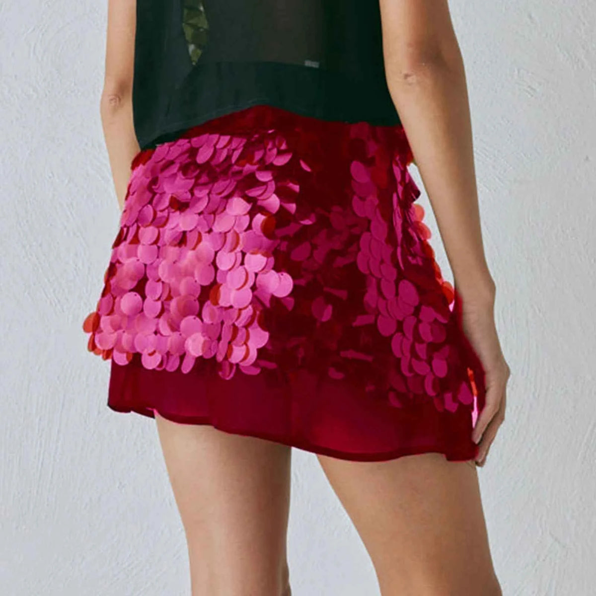Pink sequin mini skirt for women, summer fashion by Corporación Turística, stylish and shiny with a fitted pencil style.