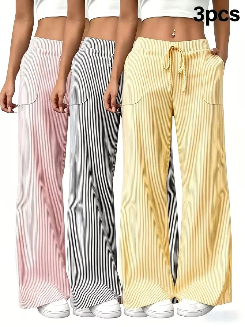 Set of three women's sports pants in pink by Corporación Turística, featuring comfortable, stylish athletic wear for active women.