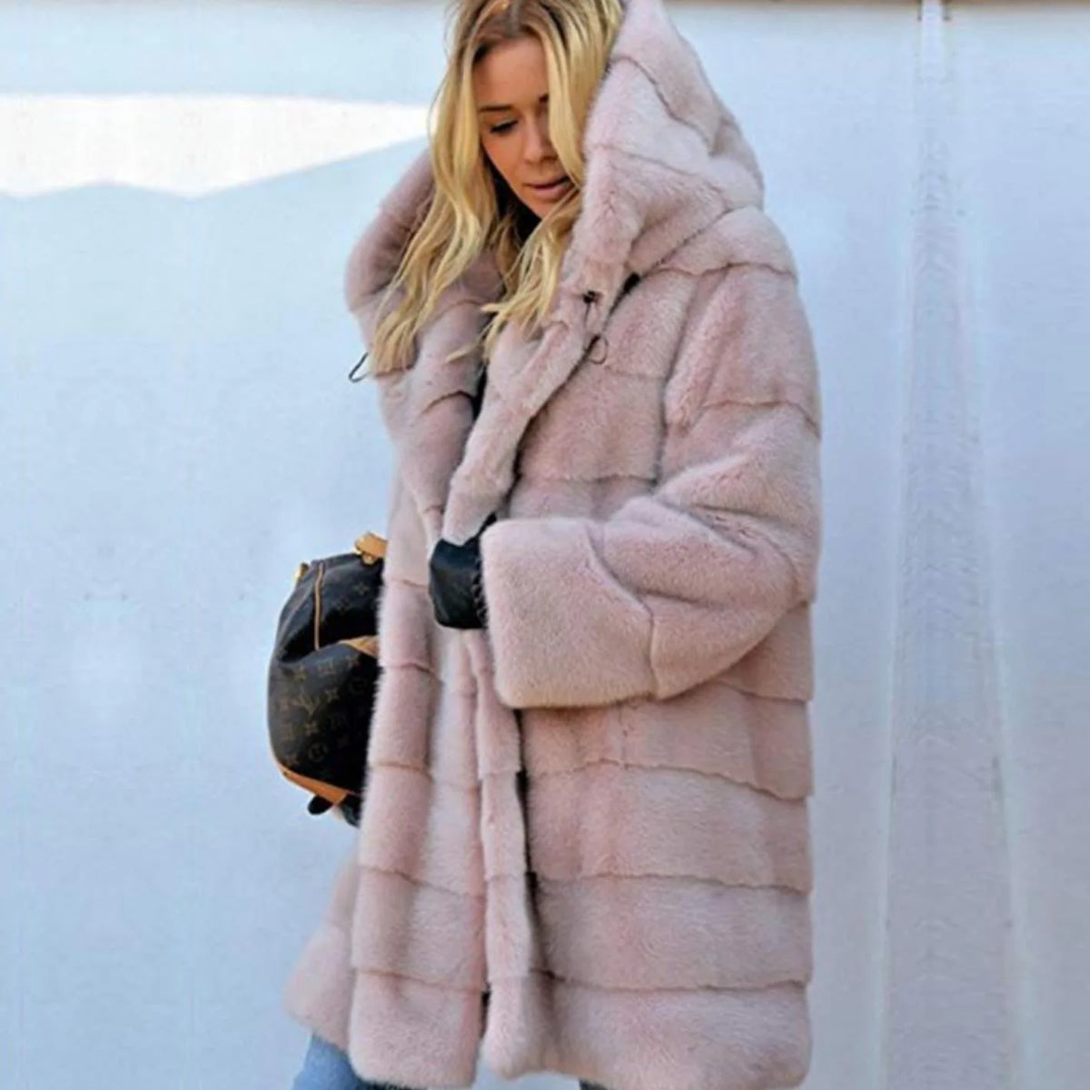 Pink women's synthetic fur coat from Corporación Turística, warm and cozy with a soft, plush texture.
