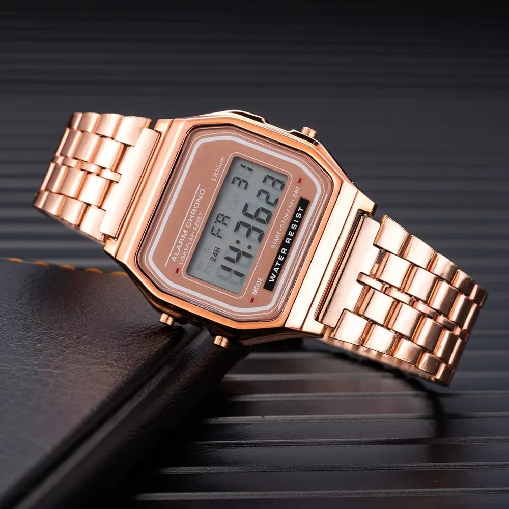 Small square LED electronic watch with stainless steel strap by Corporación Turística, showcasing its sleek design and digital display.