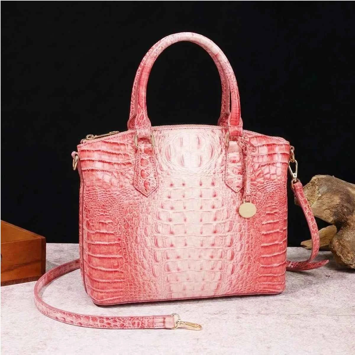 Royal blue and magenta tote bag with embossed design for women, featuring a convertible style, by Corporación Turística.