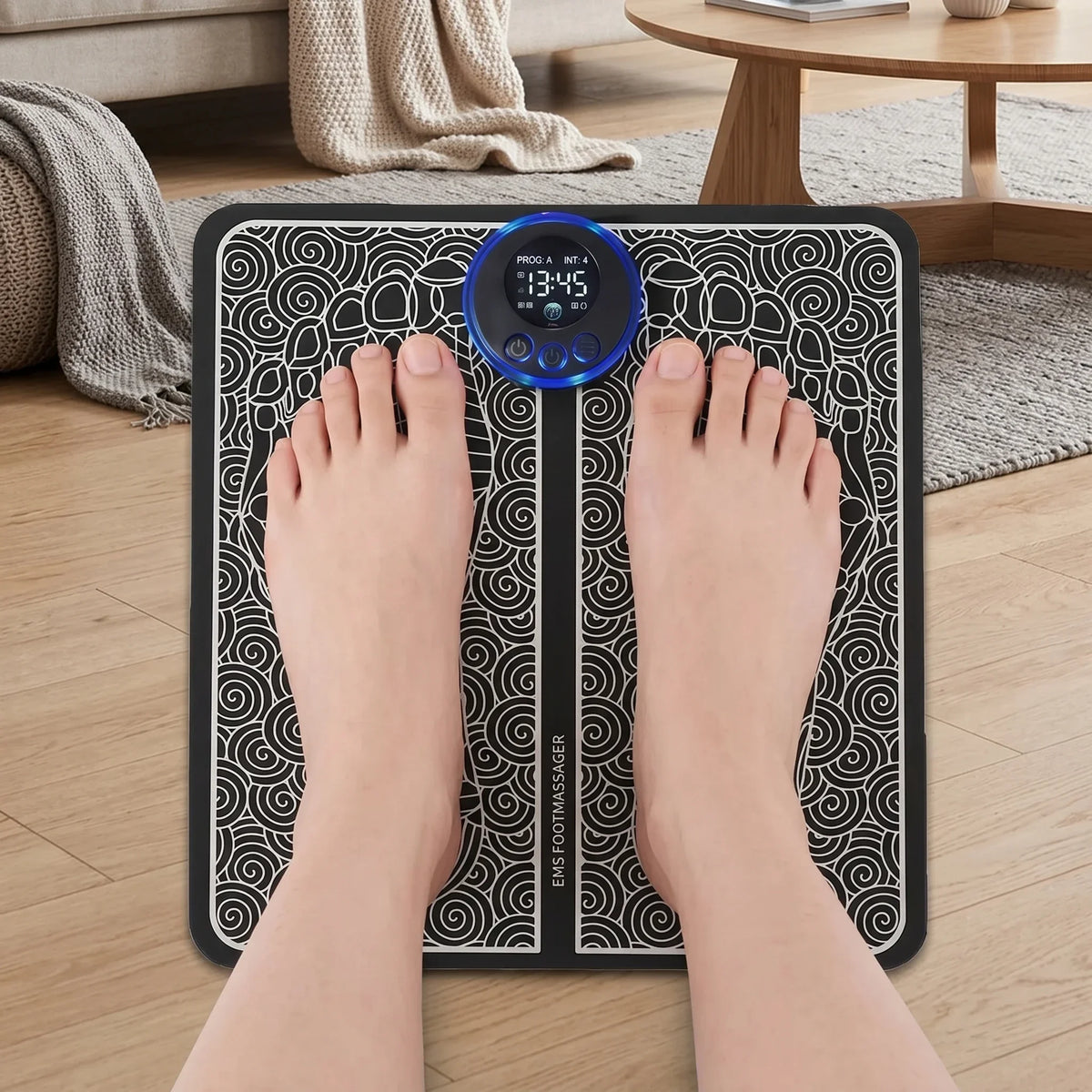 Black foot massage pad from Corporación Turística for EMS therapy, designed to relax muscles and relieve foot pain.