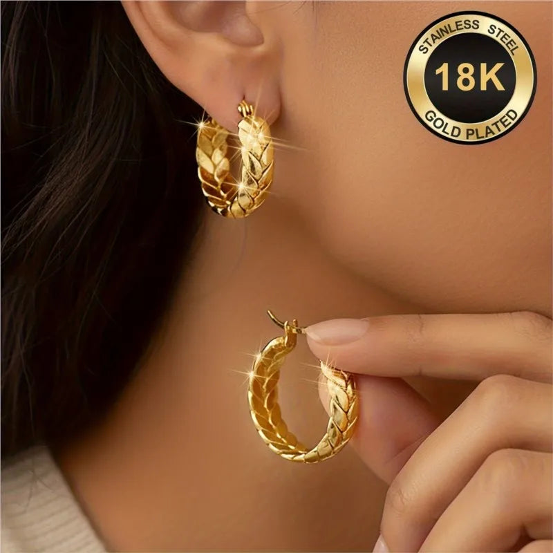 Silver 16mm stainless steel hoop earrings with gold plating from Corporación Turística, showcasing shiny, round jewelry design.