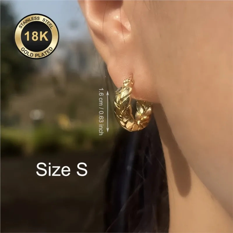 Silver 16mm stainless steel hoop earrings with gold plating from Corporación Turística, showcasing a shiny, elegant jewelry design.