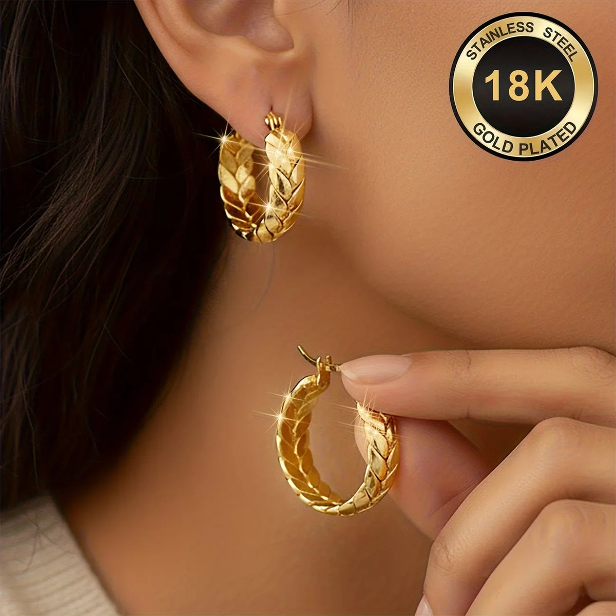Silver 16mm stainless steel hoop earrings with gold plating, stylish jewelry by Corporación Turística.