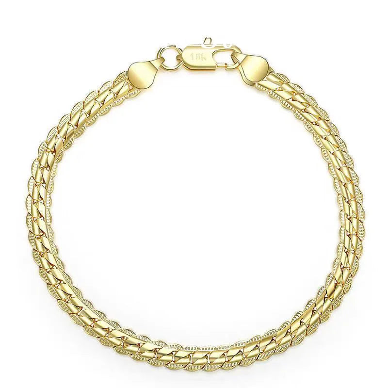 Silver 925 bracelet with 18K gold relief accents, 20cm length, crafted by Corporación Turística.