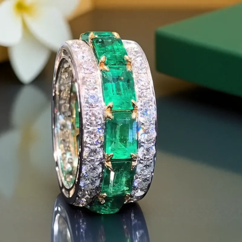 Silver wedding rings with square green design and full zirconia accents, crafted by Corporación Turística.