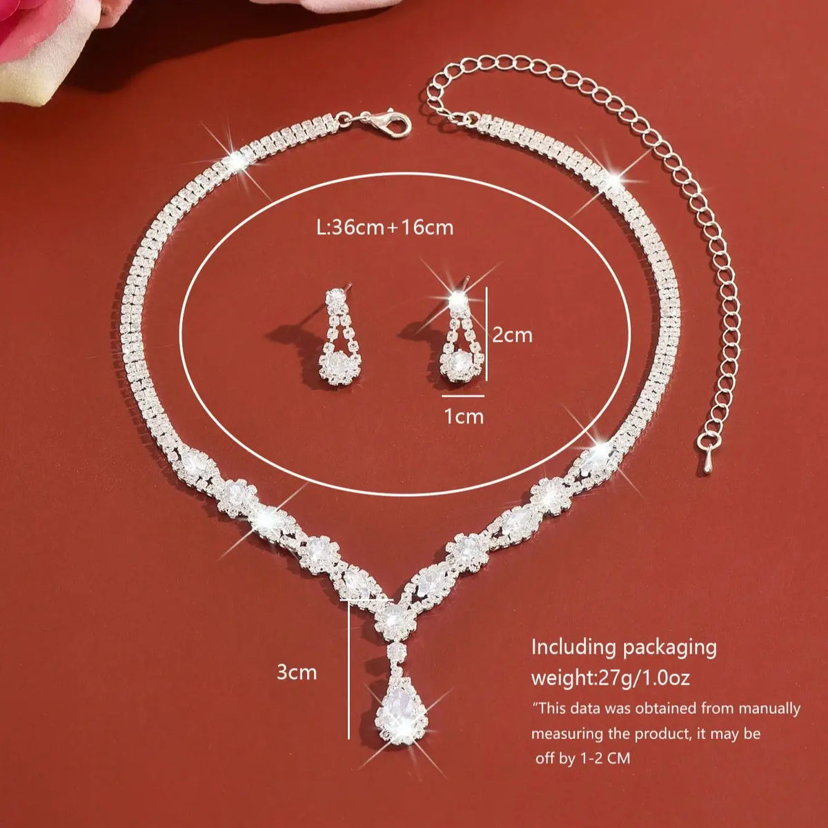 Luxury silver crystal jewelry set featuring elegant jewelry pieces with intricate shapes and sparkling crystal details.