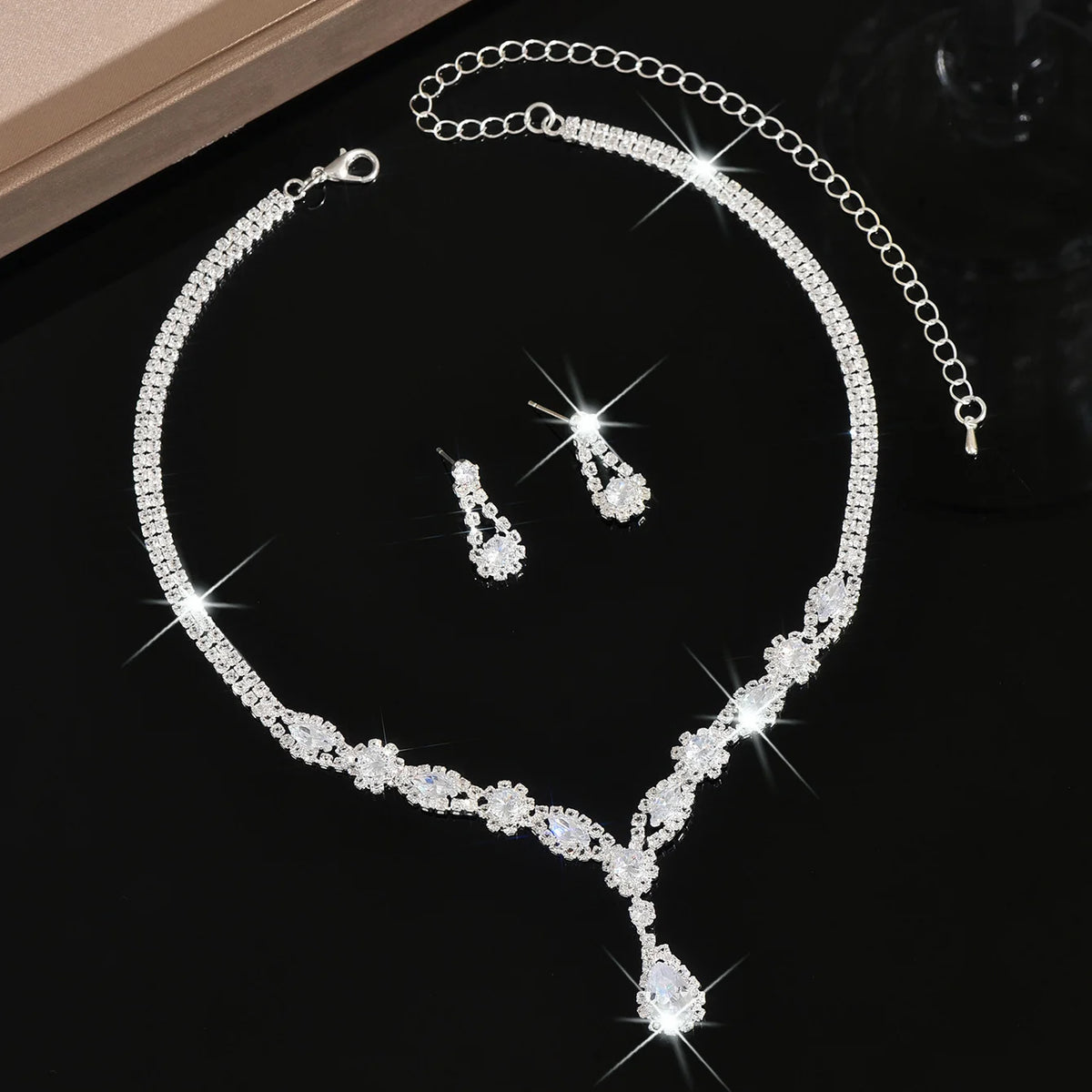 Luxury silver crystal jewelry set featuring elegant shaped pieces, perfect for sophisticated accessorizing.