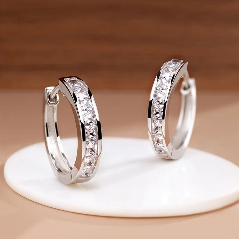 Silver 92% sterling earrings with sparkling cubic zirconia stones, featuring elegant and shiny design from Corporación Turística.