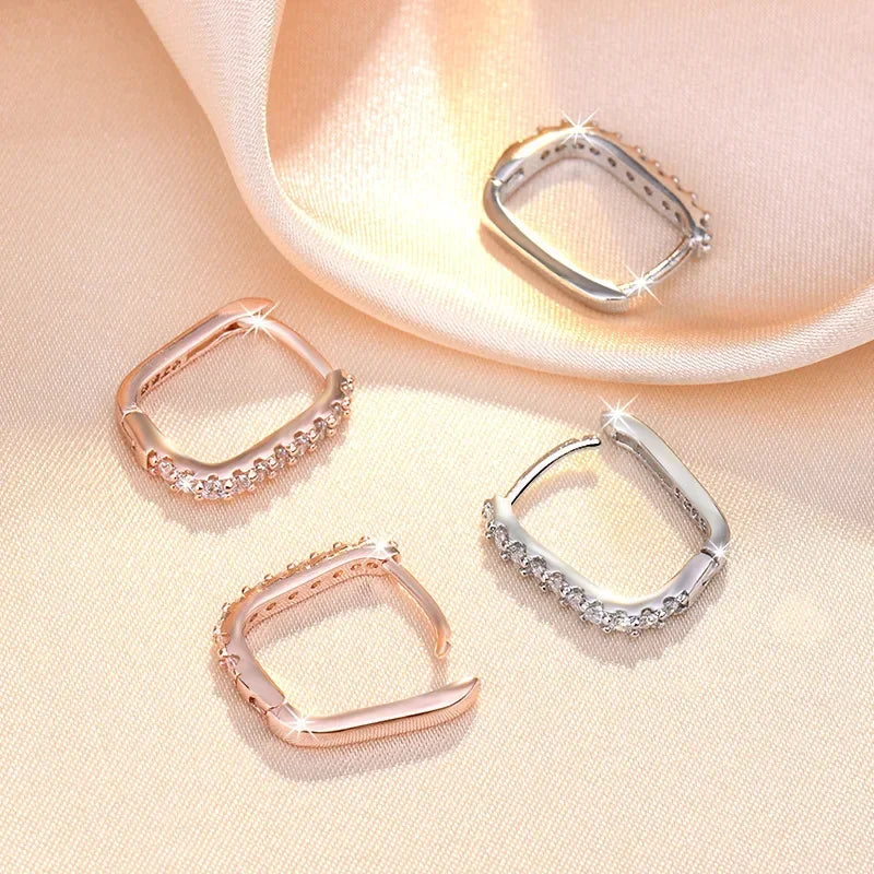 Sterling silver 925 hoop earrings with circular design, stylish jewelry by Corporación Turística.