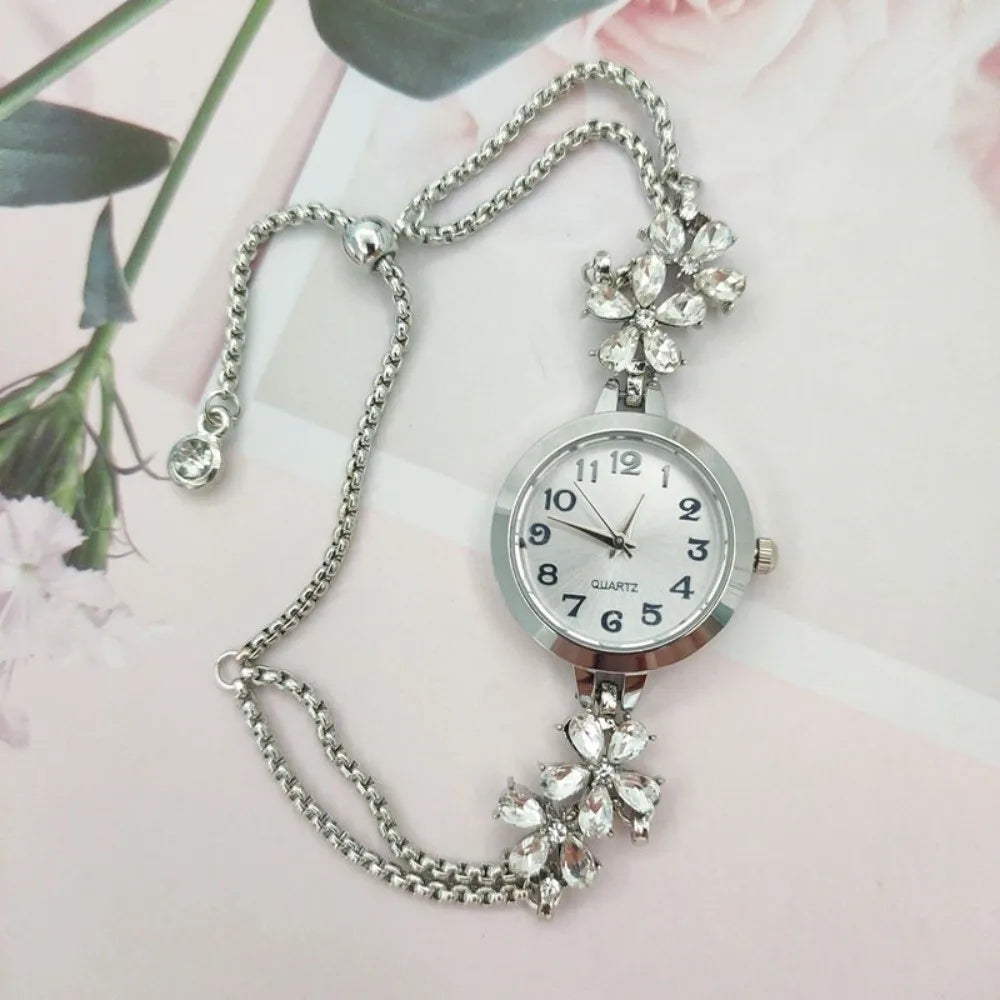 Silver adjustable quartz women's watch by Corporación Turística with water resistance, featuring a sleek design and easy-to-read dial.