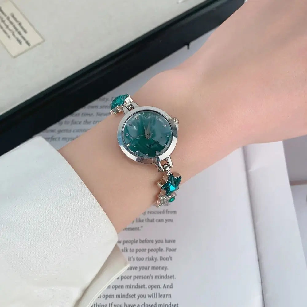Elegant silver and white adjustable bracelet watch with sparkling pedrería from Corporación Turística, showcasing a stylish, sophisticated design.