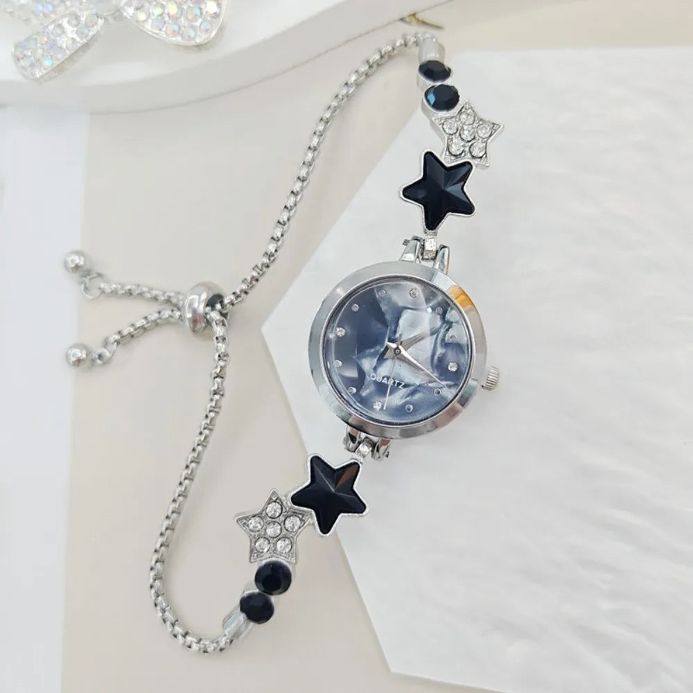 Elegant silver-white adjustable bracelet watch with sparkling embellishments by Corporación Turística, featuring a stylish and sophisticated design.