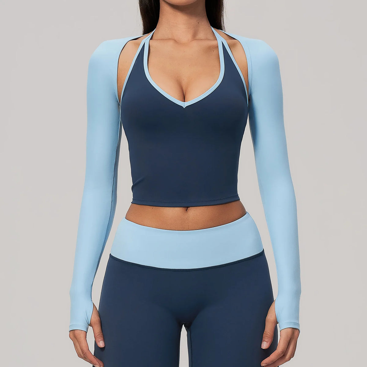Sky blue long-sleeve backless yoga T-shirt for women by Corporación Turística, lightweight and comfortable for active wear.