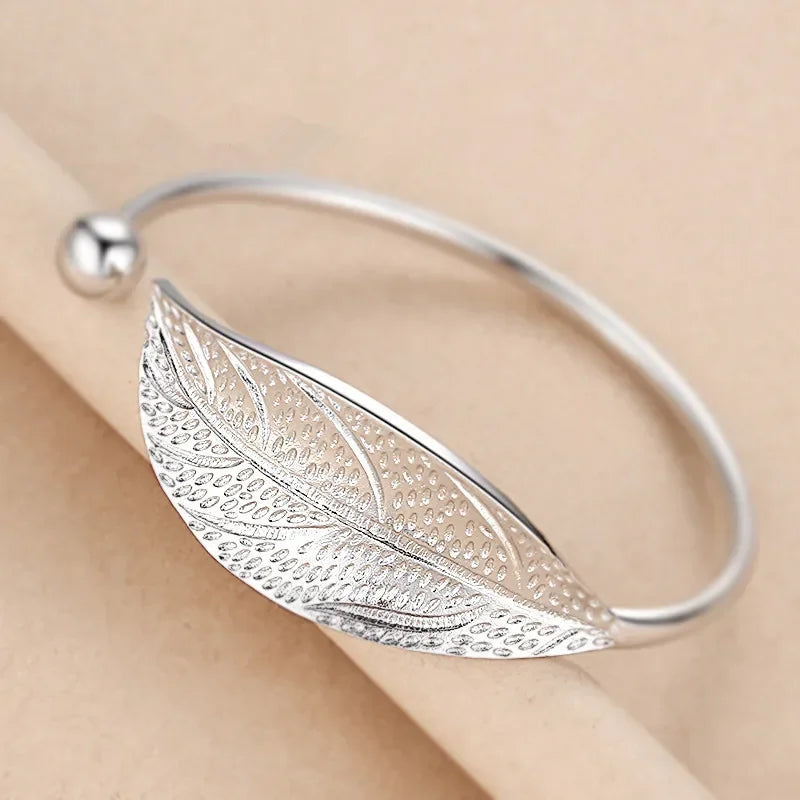 Sterling silver 925 bracelet with open display design, crafted by Corporación Turística, shown on a neutral background.