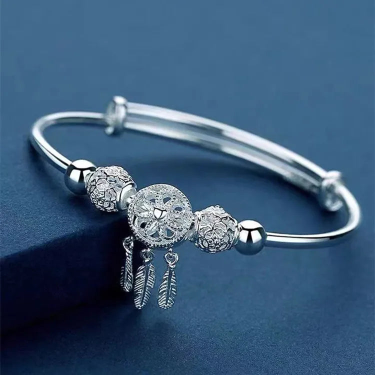 Sterling silver 925 bracelet with open display design, featuring intricate metalwork and a polished finish.