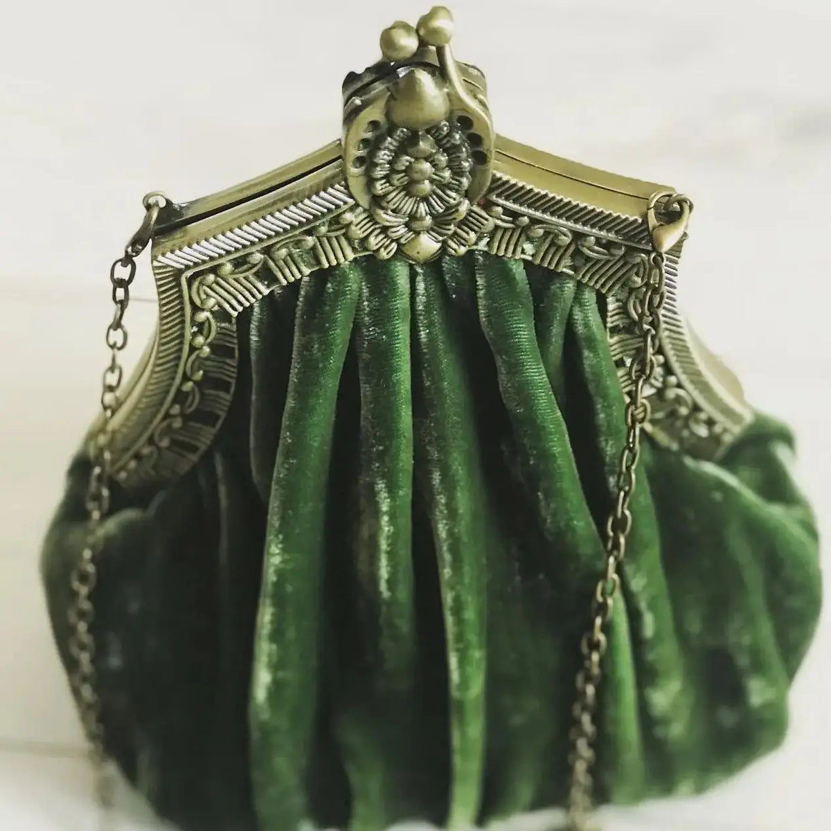 Vintage velvet clutch bag from Corporación Turística with a secure clasp closure, stylish and elegant for special occasions.