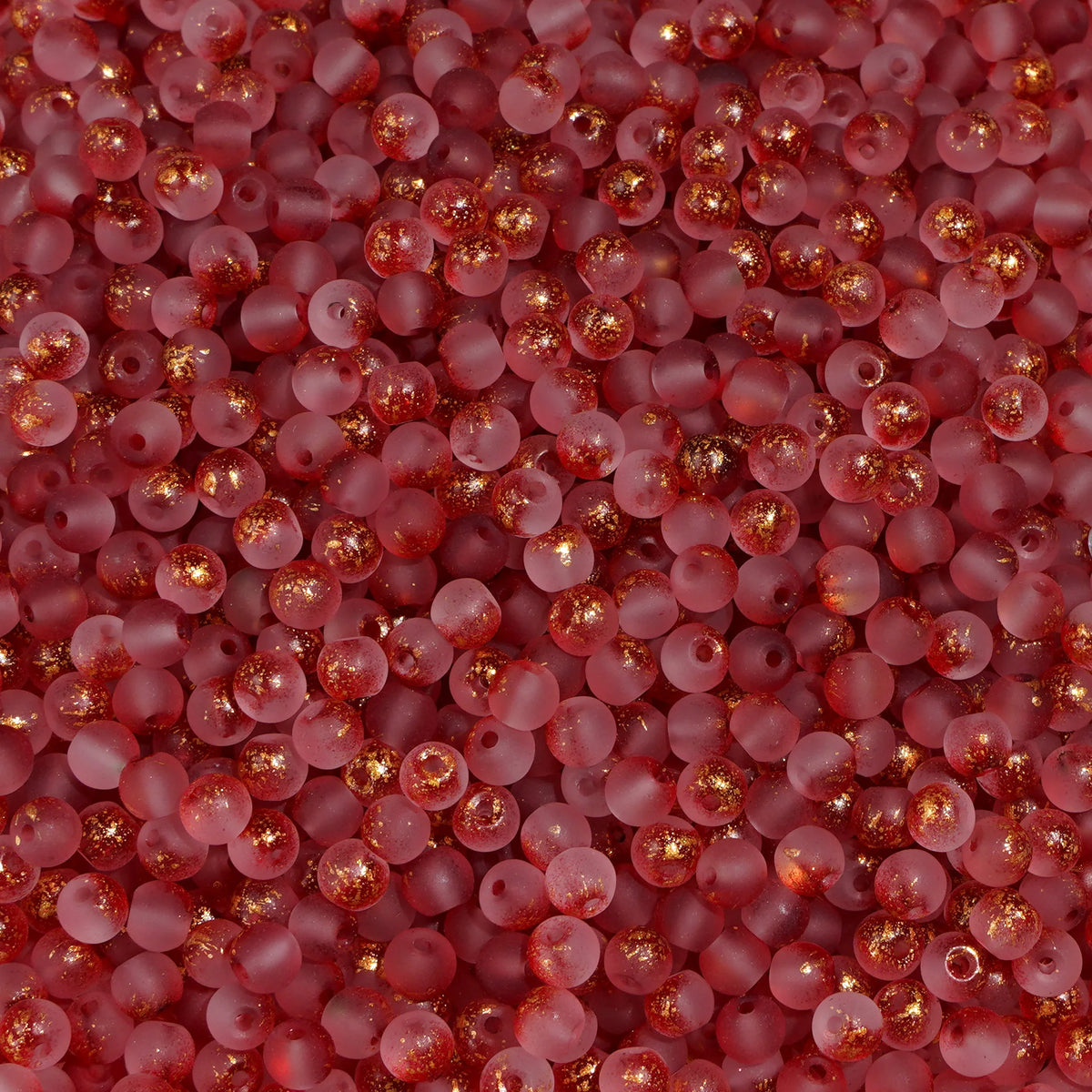 Set of 100 gold-splashed glass rice beads from Corporación Turística, 4mm, shiny and colorful for jewelry making and craft projects.