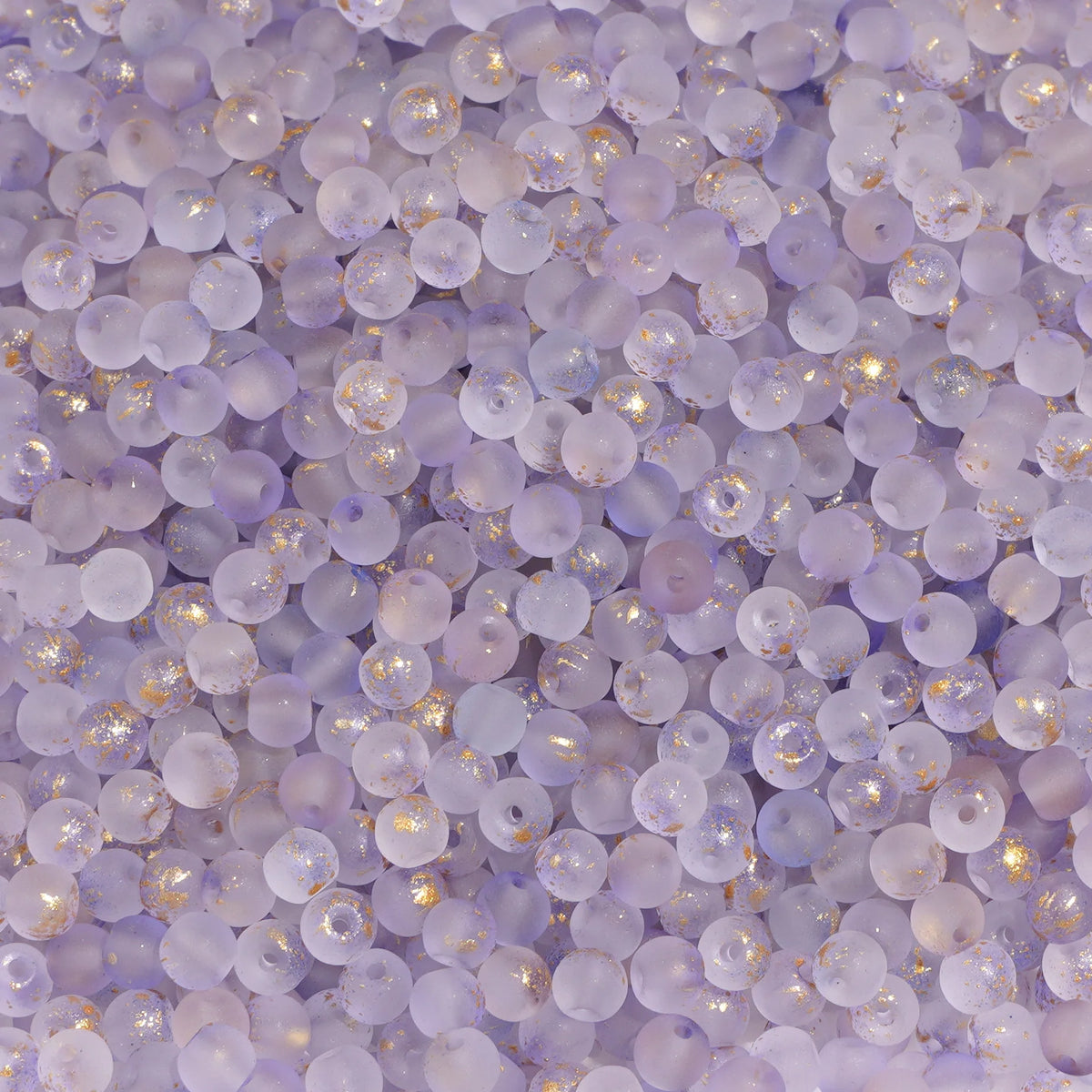 Set of 100 gold-splashed glass rice beads by Corporación Turística, 4mm, perfect for jewelry making and craft projects.