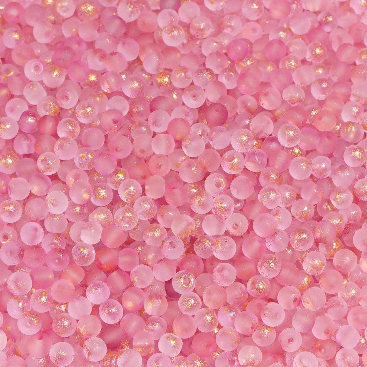Set of 100 gold-splashed glass rice beads by Corporación Turística, 4mm size, ideal for jewelry making and craft projects.