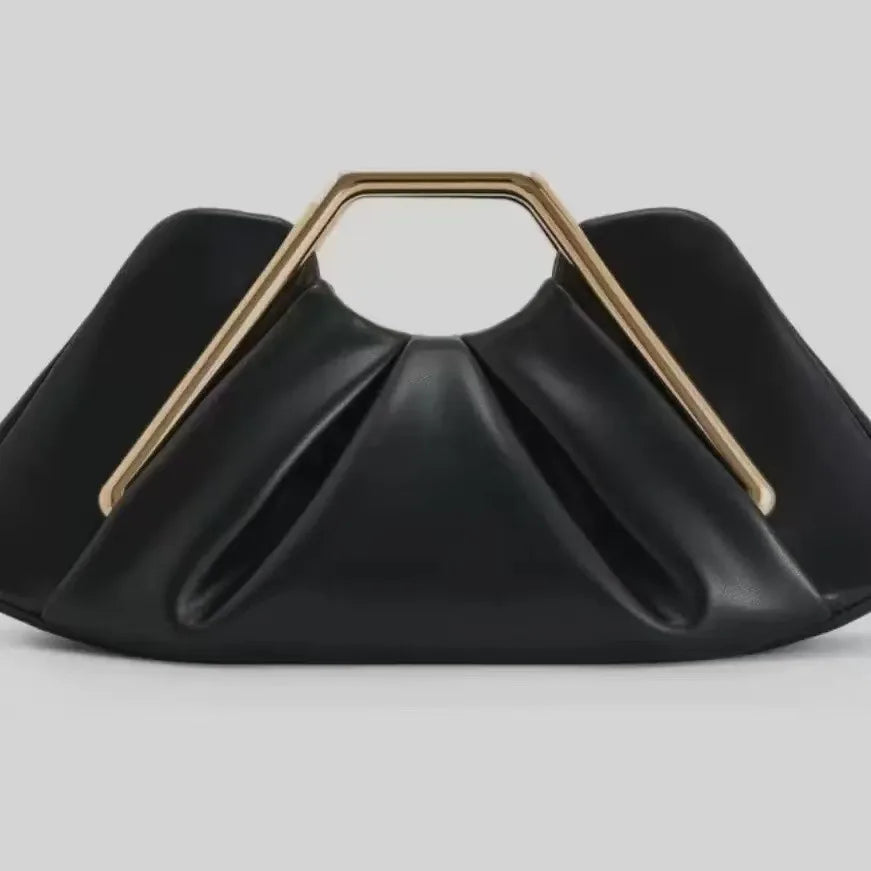 Soft black leather women's bag from Corporación Turística with cloud-inspired design and textured surface.