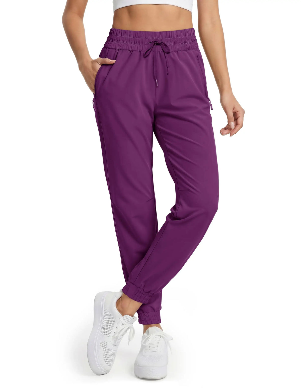 Magcomsen waterproof hiking pants for women in tomato red, outdoor gear with durable, breathable fabric for outdoor adventures.