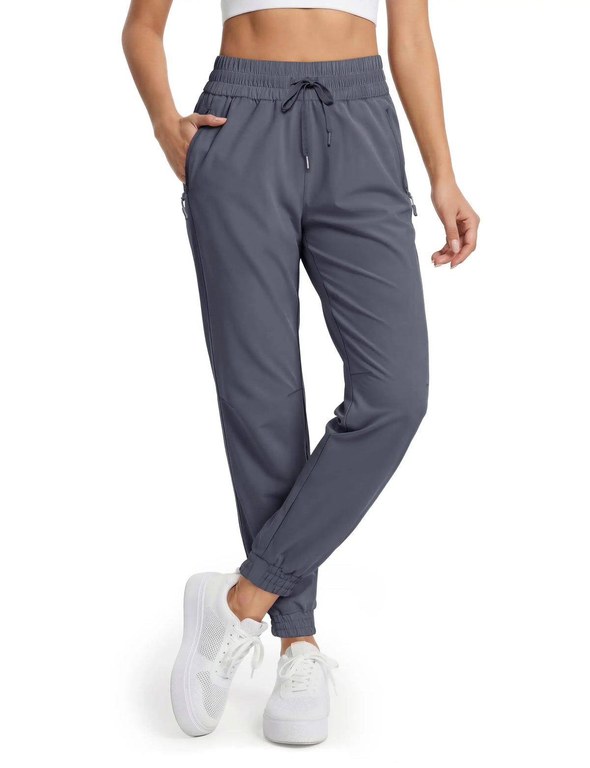 Magcomsen waterproof hiking pants for women in vibrant tomato red, designed for outdoor activities and durable weather protection.